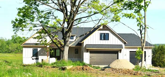 New modular home nearing completion with siding and roofing finished